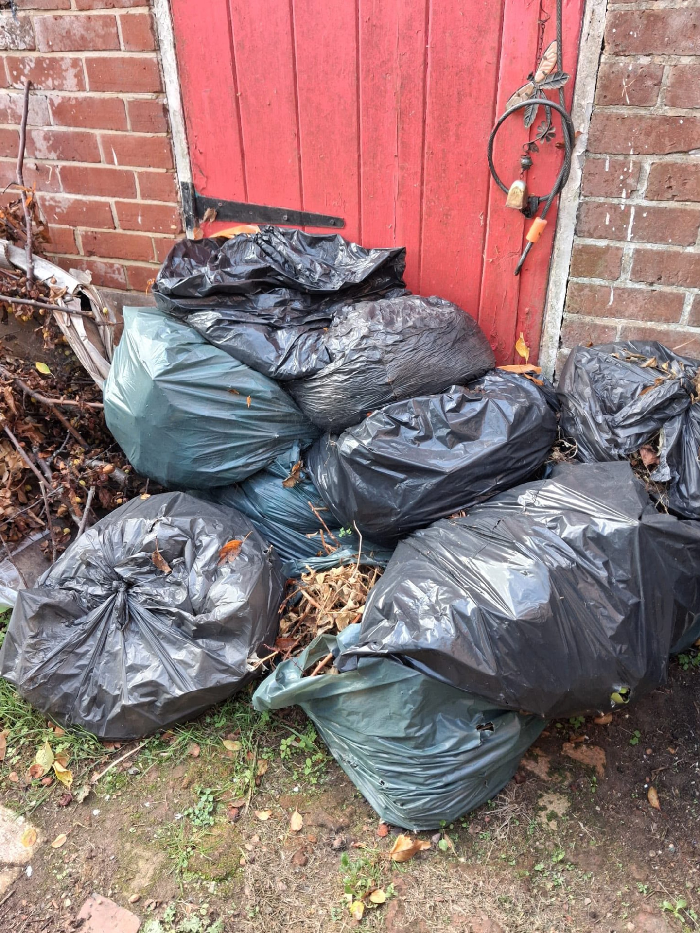 Black and green rubbish bags awaiting collection in Wimborne, Dorset