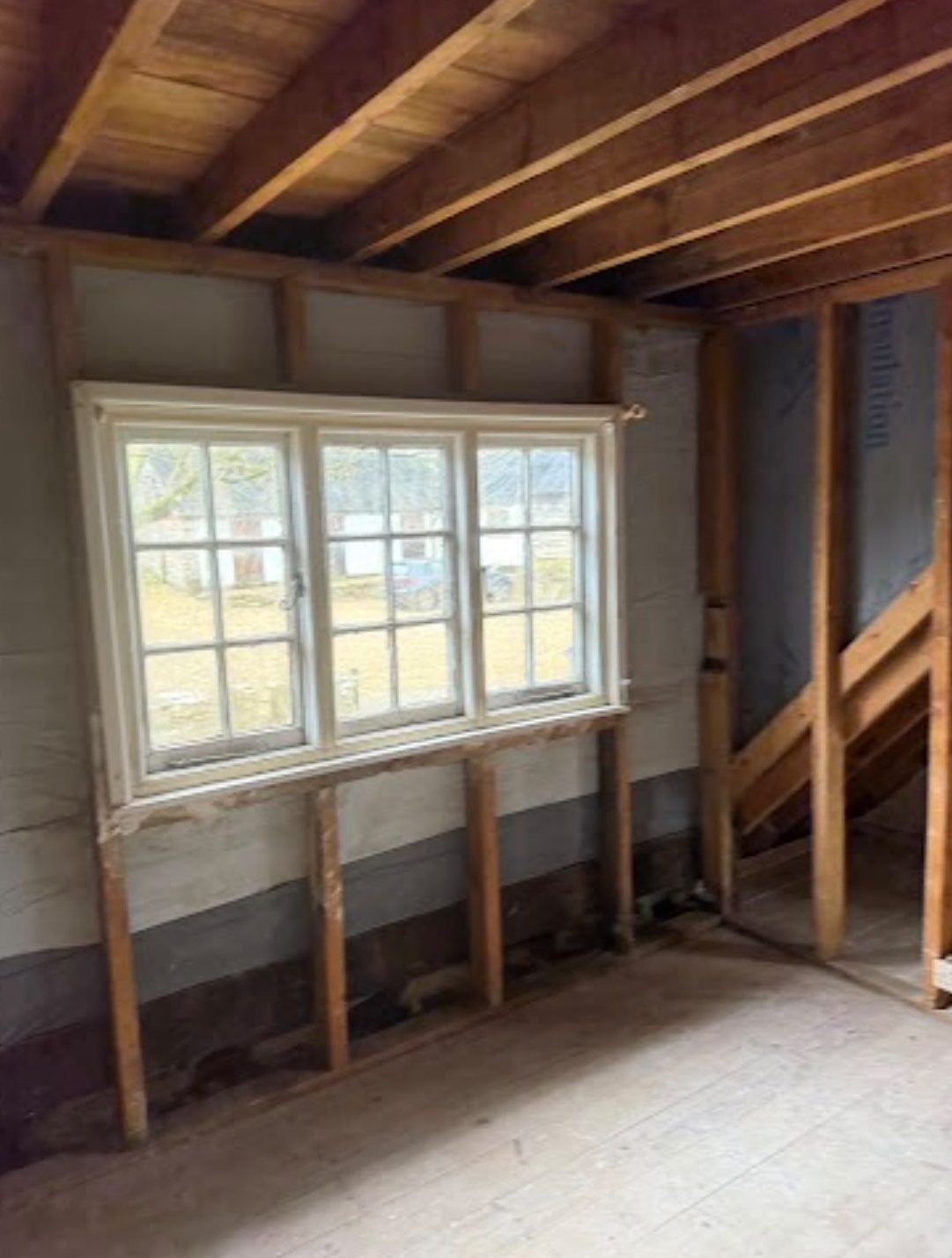 Room stripped to exposed joists and framing after internal demolition in Wimborne, Dorset