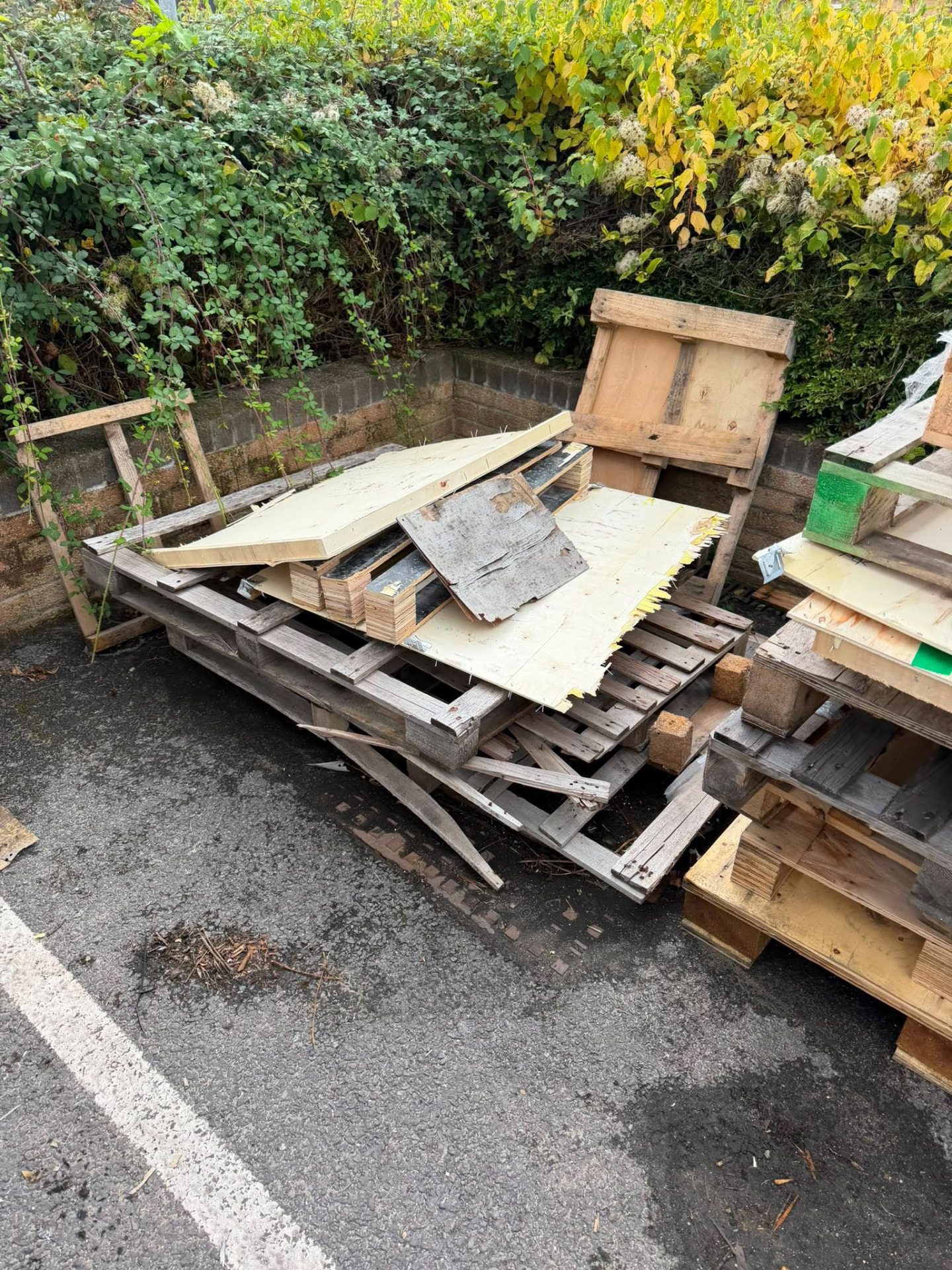 Dismantled timber and sheet material awaiting rubbish collection in Wimborne, Dorset