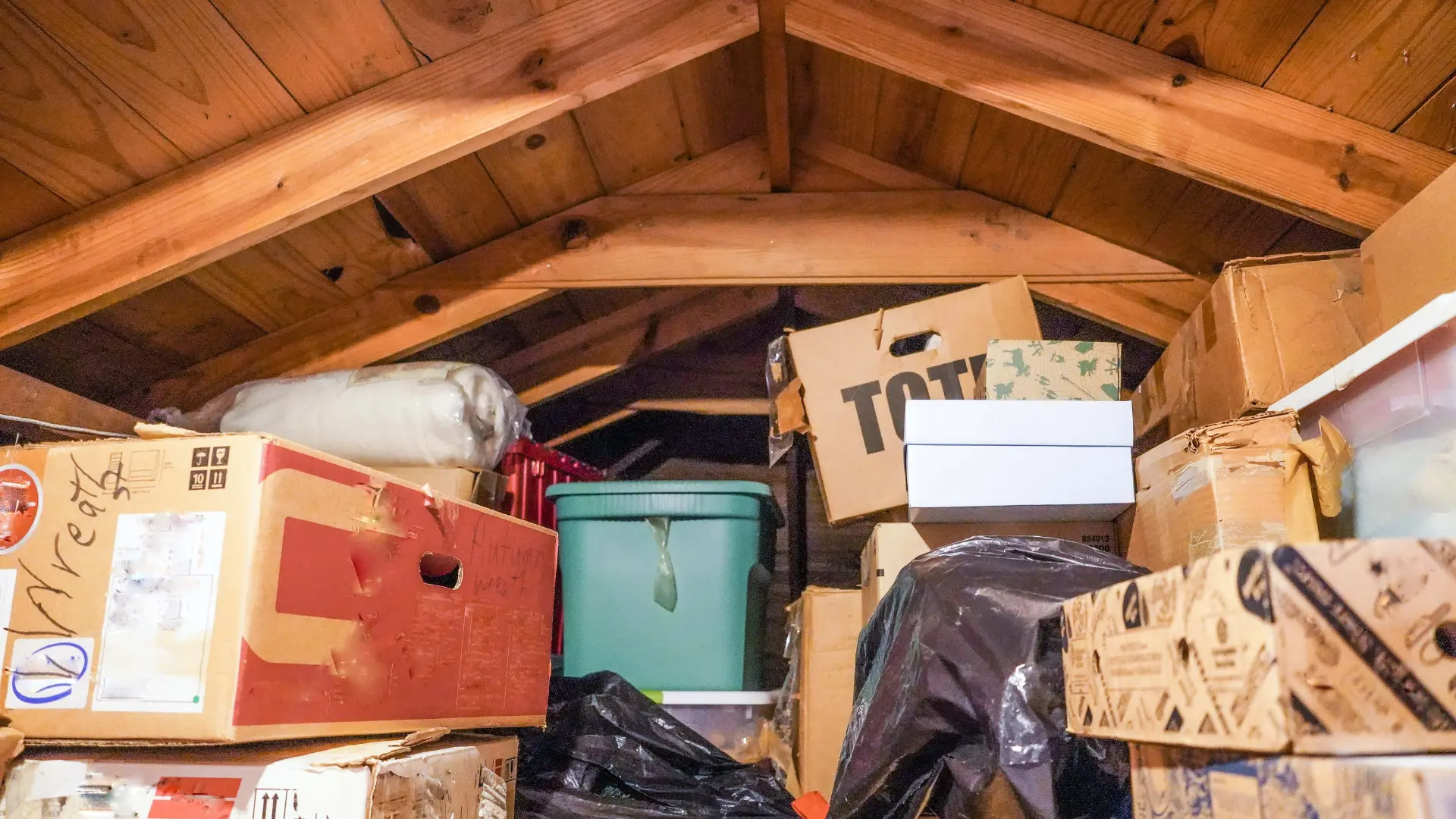 Loft full of boxes and bags awaiting loft clearance in Dorset