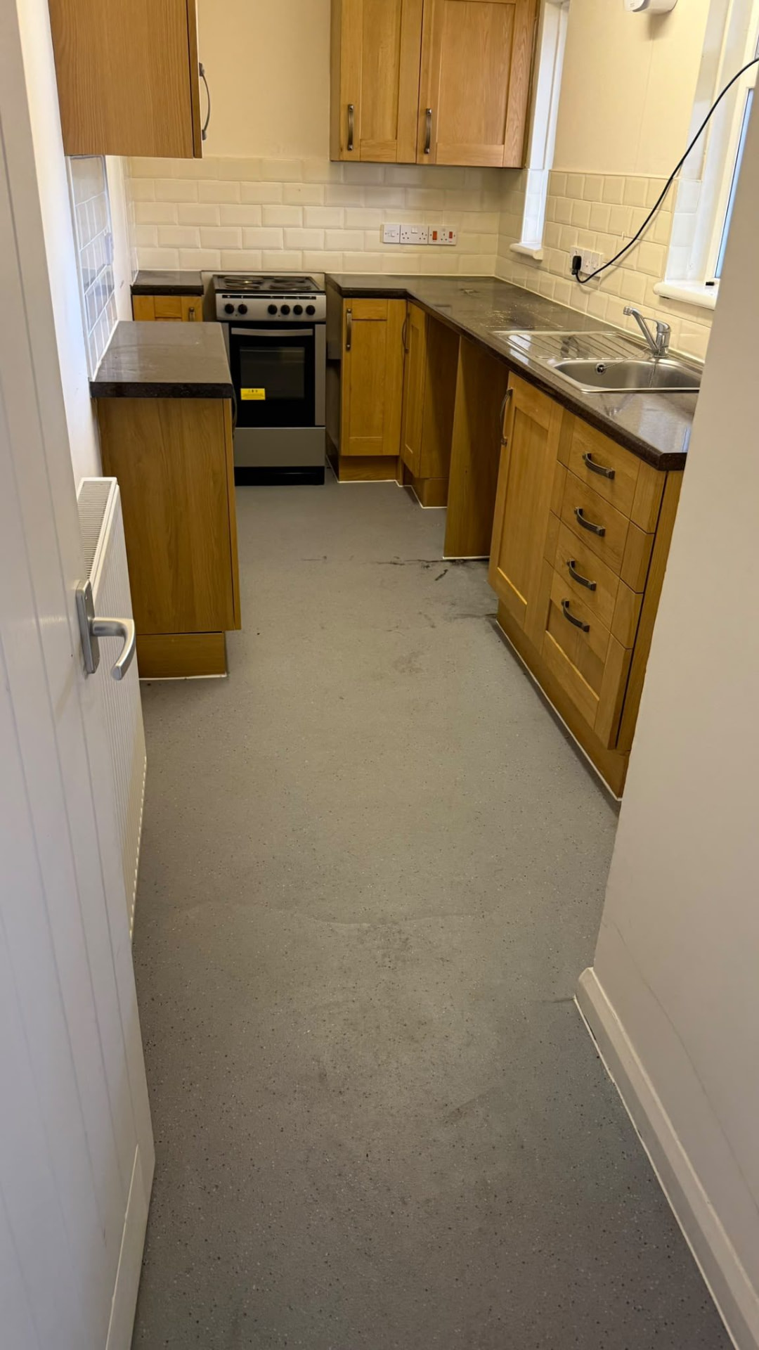 Empty kitchen after a house clearance in Wimborne, Dorset