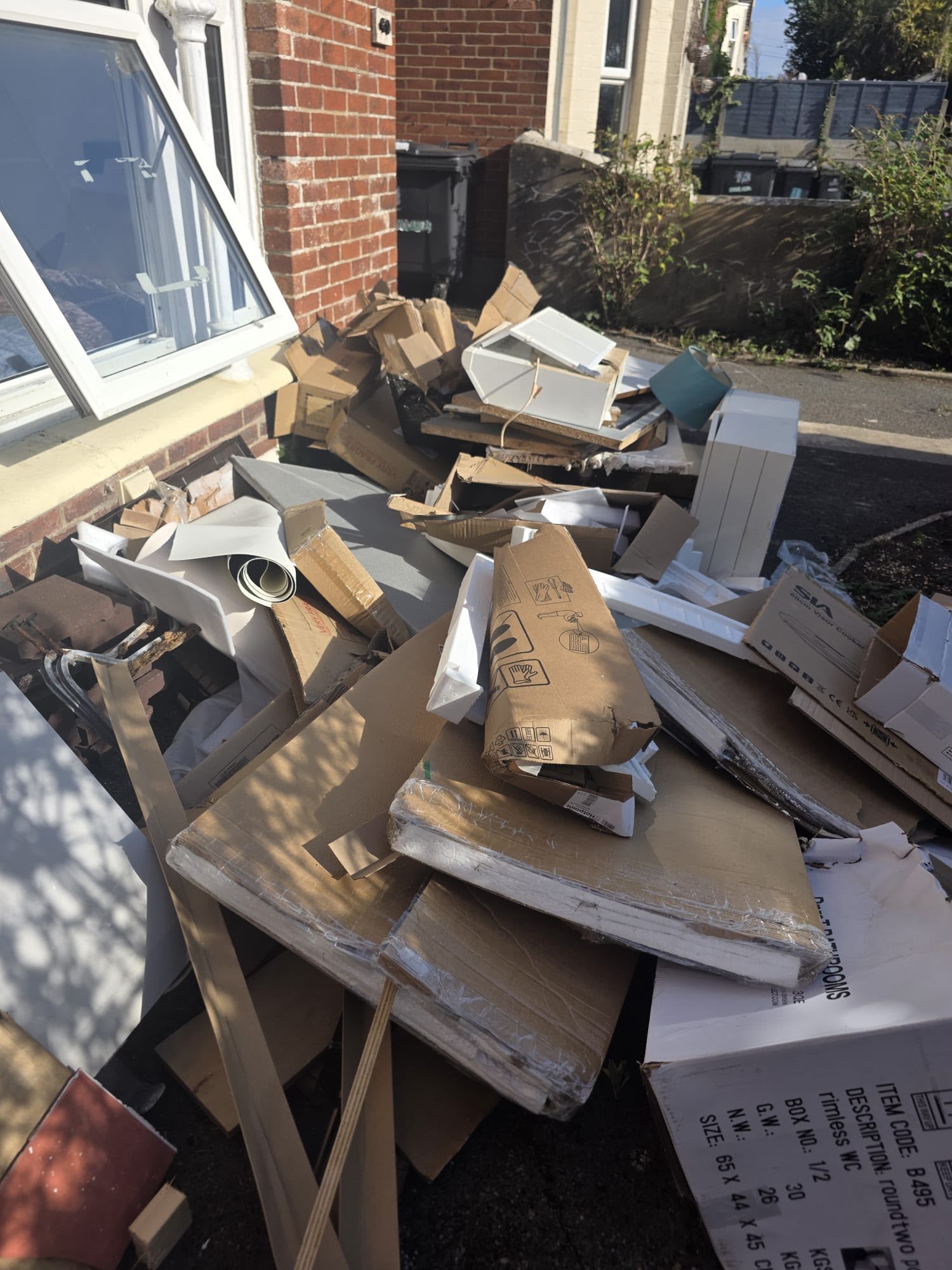 Construction packaging and bulky debris awaiting rubbish removal in Wimborne, Dorset
