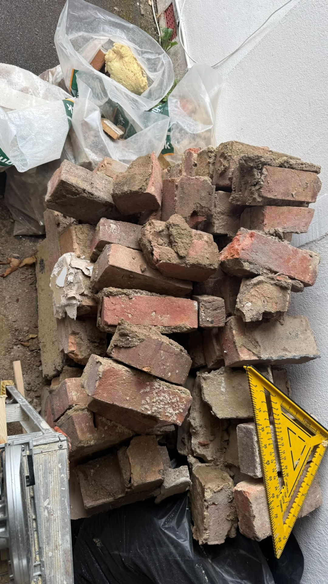 Pile of bricks and rubble awaiting rubble collection in Wimborne, Dorset
