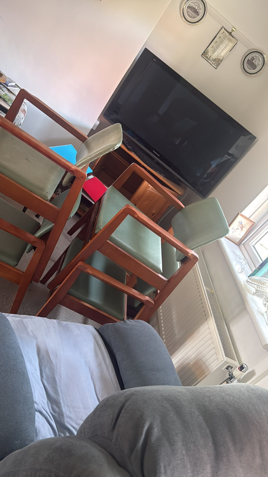 Living room full of furniture before a house clearance in Wimborne, Dorset