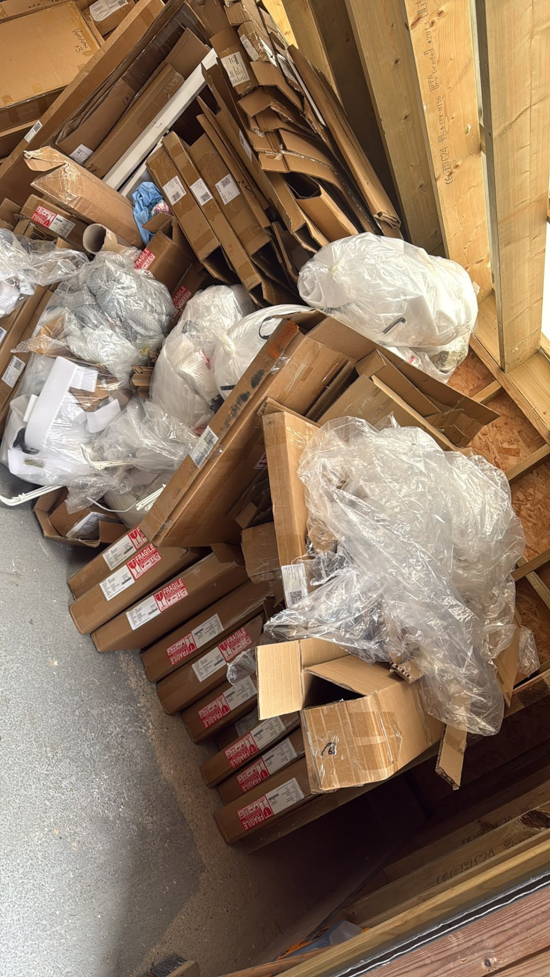 Cardboard boxes and plastic packaging awaiting waste collection in Wimborne, Dorset